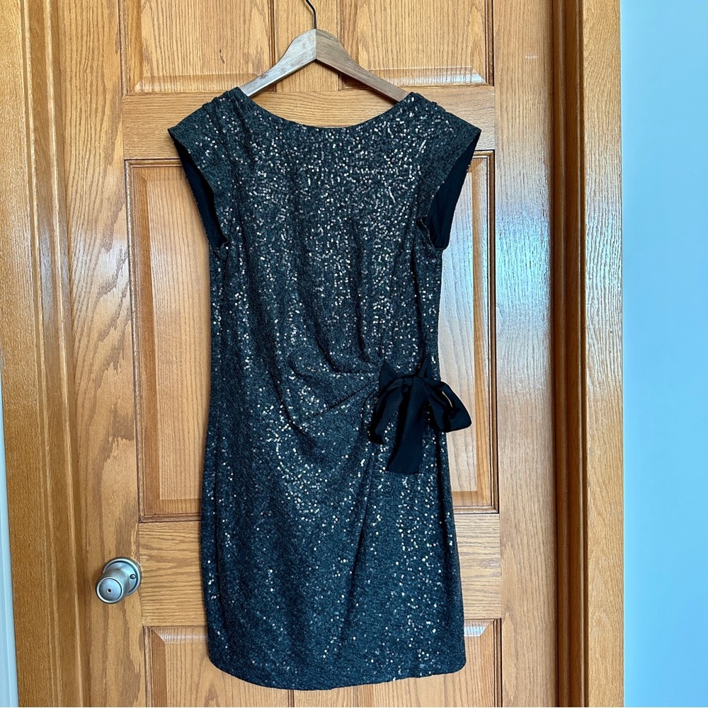 Grey sequined party dress with black bow
